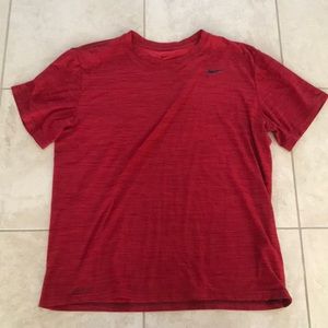 Red Nike dri-fit t shirt with black stripes